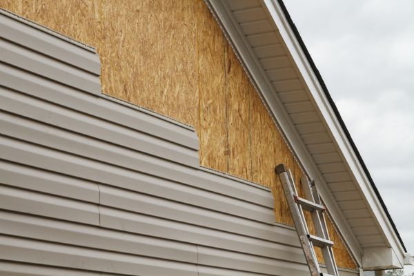 Grey Vinyl Siding Installation in Spring