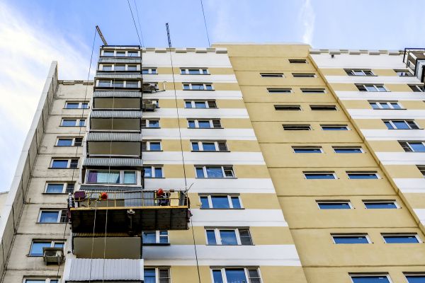 Building Cladding Installation in Spring